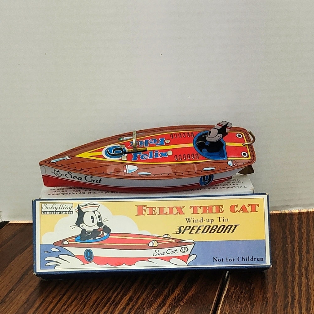Felix the Cat 90's Wind-up Tin Speedboat - Red Blue Brown. New In Box